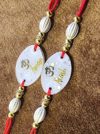Another set of personalized Om rakhis for brothers Aman and Akash.
