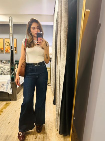 A timeless combination of a white t-shirt and dark wash flared jeans. I added a belt and heeled loafers to make it more polished.