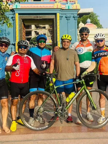 Part of the crew with their bikes at the temple. It's a great blend of fitness, friendship, and faith.