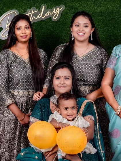 A beautiful group photo of the women in the family celebrating the little one's birthday.