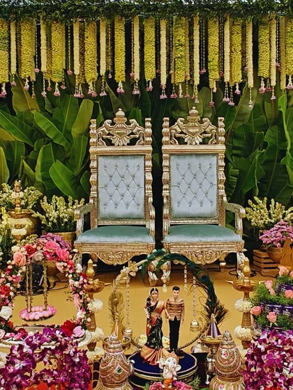 A beautiful, traditional setup for a South Indian ceremony, rich with detail. We combined ornate golden chairs, fresh floral arrangements, brass lamps, and offerings to create a sacred and picturesque space for the couple.