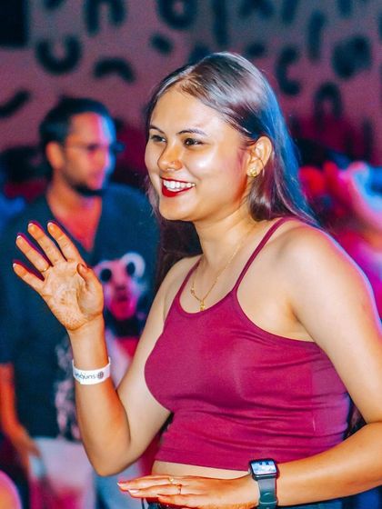 A happy guest smiling and dancing. The positive energy is what makes my parties special.