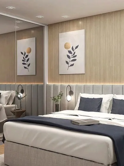 This bedroom features a large mirrored wardrobe that visually doubles the space. The design is both practical and aesthetically pleasing.