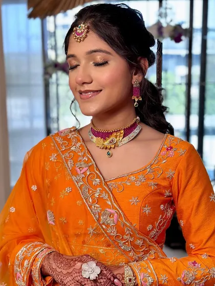 A close-up of Janvi's simple and elegant makeup. The focus is on her radiant skin and beautiful smile.