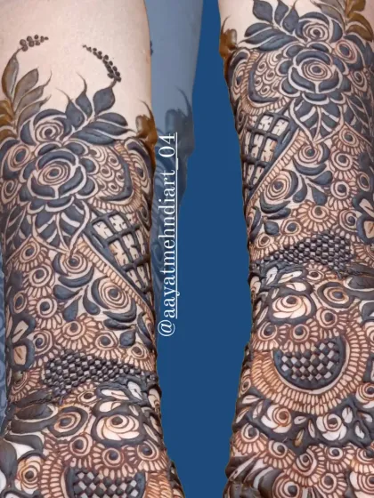 A closer look at the details of this bridal henna design, with its bold floral elements and delicate line work.