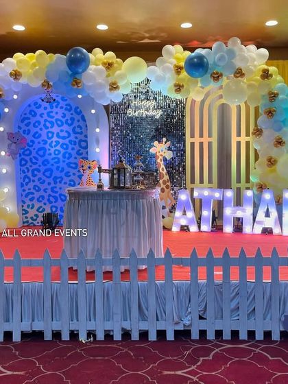 The white picket fence adds a charming touch, creating a designated and safe play area for the little ones in front of the main stage.