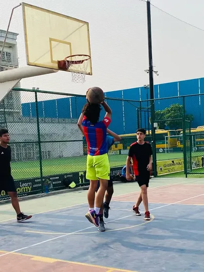 Going up strong for a rebound. Boxing out and securing the board is a fundamental part of the game that we drill into every player.
