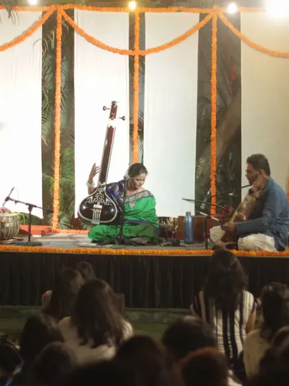 A full stage view with vocalist Rageshri Das and sarangi player Sarfaraaz Khan.
