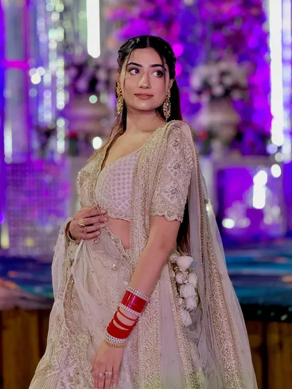 A close-up of the outfit and the soft, glowing makeup.