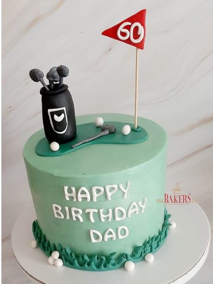 A golf-themed cake for a dad's 60th birthday. This is a no-fondant cake with just a few fondant accents on top, like the golf bag and clubs. It's a fun way to celebrate a favorite hobby.