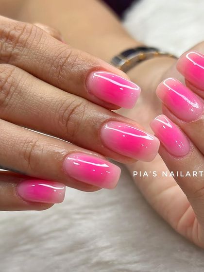 Pink aura magic on natural nails. This shows how we can achieve the trendy airbrushed look even on shorter nails.