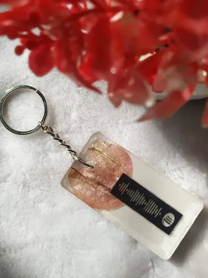 This unique keychain features a scannable Spotify code that plays your special song. I preserved flower petals in the background, combining a personal memory with a personal soundtrack.