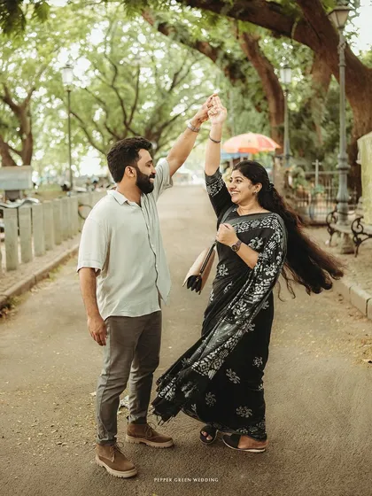 A spontaneous dance in a tree-lined lane. Fort Kochi's romantic atmosphere is the perfect setting for a pre-wedding story filled with movement and joy.