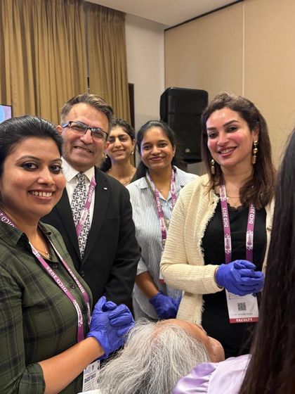Posing with fellow doctors during a training event. Collaborating with other experts in the field helps us all provide better care for our patients.