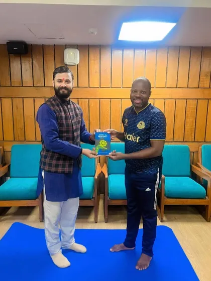 A moment of connection with a student from Tanzania after a rewarding yoga session.