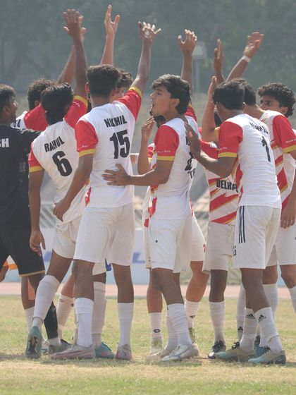 Another shot of the team huddle, showcasing the brotherhood and focus before a match.