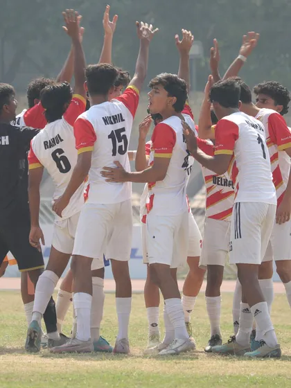 Another shot of the team huddle, showcasing the brotherhood and focus before a match.