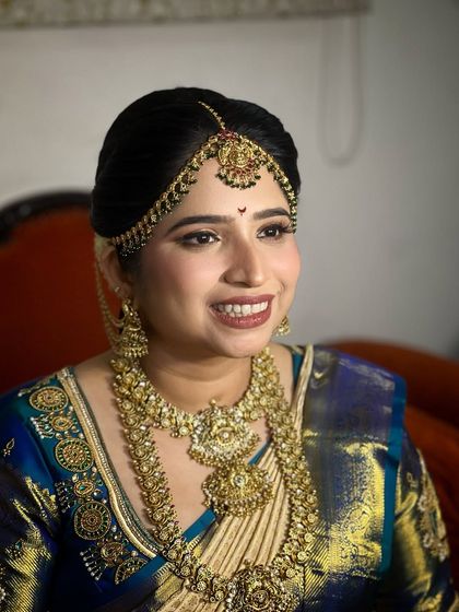 A close-up of the bride's classic look, her smile radiating happiness.