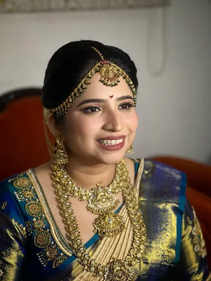 A close-up of the bride's classic look, her smile radiating happiness.