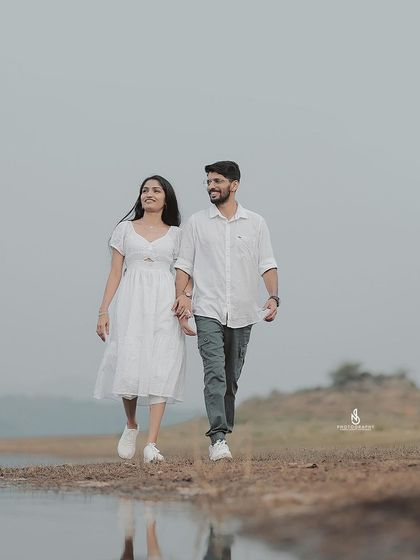 A duplicate of 307, a beautiful walking shot with their reflection in a puddle.