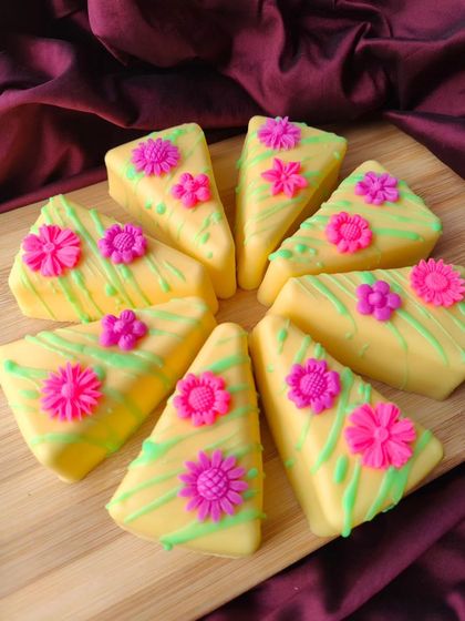 When life gives you lemons, make lemon pastry soap. This soap slice looks just like a piece of cake, with a yellow base, green drizzle, and tiny pink flowers on top. It has a fresh, citrus scent.