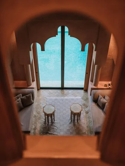A view from inside the Amanjena resort in Marrakesh during a project for Tom Ford Beauty. The architecture frames the shot naturally. I focus on capturing the unique mood and design of luxury destinations. Shot on the Sony a1.