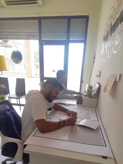 A typical day at the Elite Design Architects office. Here you can see my team hard at work, drafting plans and bringing our creative visions to life on paper before they are built on site.