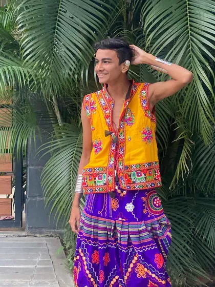 A happy and confident pose in this yellow and purple set. My men's collection is designed to be comfortable and stylish, so you can dance with ease.
