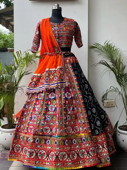 The full outfit on a mannequin, showing how all the pieces come together. This is a bold and beautiful choice for any Garba enthusiast.