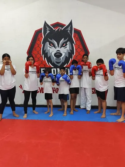 A group of our young students ready for their boxing and kickboxing class. We foster a sense of teamwork and motivation.