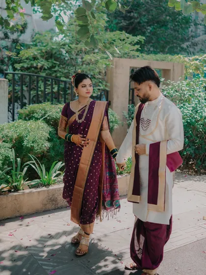 A quiet, thoughtful moment between the couple. Holding hands, they share a gentle look that speaks of their deep understanding and connection.