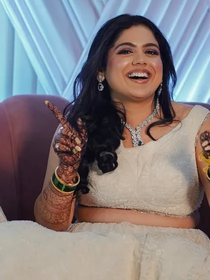 My bride Shivani looked like a princess in white for her Sangeet. We created a soft and dreamy look with glowing skin and gentle waves in her hair, perfect for dancing the night away.