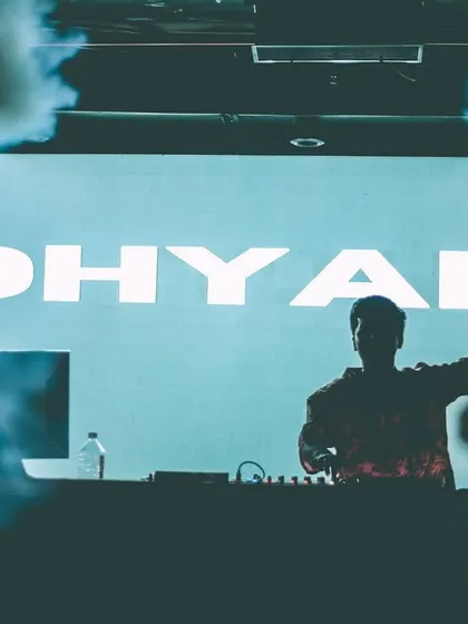 A silhouette of me against my custom visuals, framed by smoke. This shot captures the atmospheric and moody vibe of my sets.