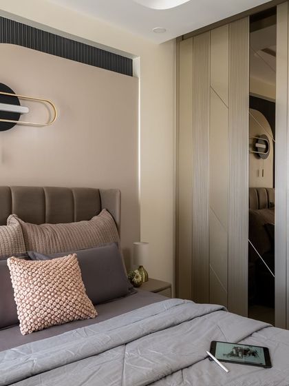 This daughter’s bedroom is a blend of functionality and aesthetics, designed with a calming and serene color palette. The minimalist approach and ample hidden storage keep the space efficient, organized, and beautiful.