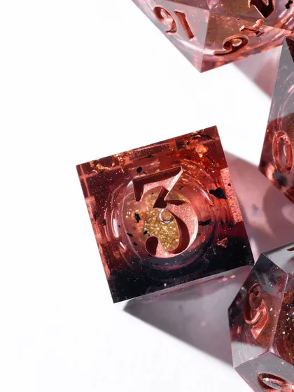 A macro shot of a single die, focusing on the intricate details and glittery inclusions. This type of close-up is perfect for showcasing the craftsmanship of a product.