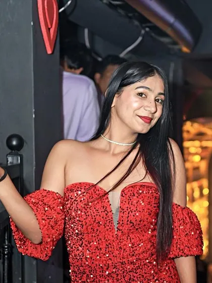 A guest in a stunning red sequin dress for the Valentine's Day party.