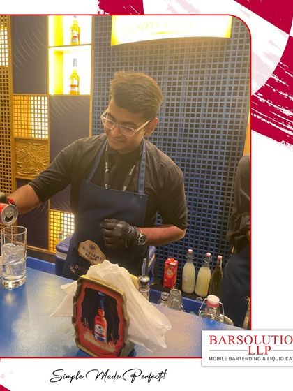 Pouring a drink with precision at the Filmfare Awards, ensuring every serve was perfect for Bollywood's finest.