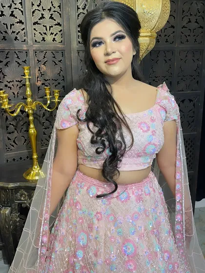 A front-facing view of this pretty pink engagement makeup. The look is soft, feminine, and glowing, perfect for a daytime or evening event.