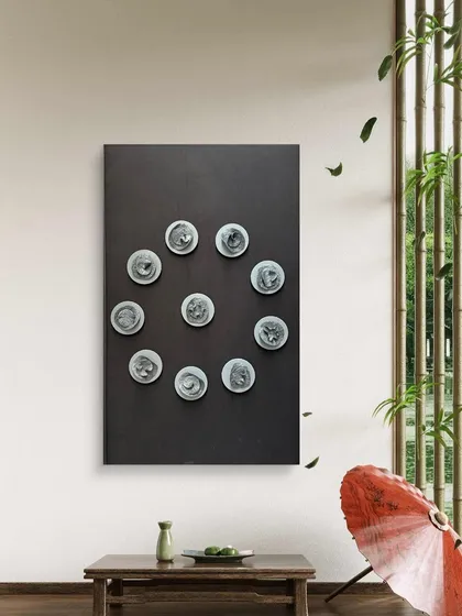 Here, the 'Navagraha' piece is styled in a zen-inspired space, complementing the natural elements and creating a meditative atmosphere.