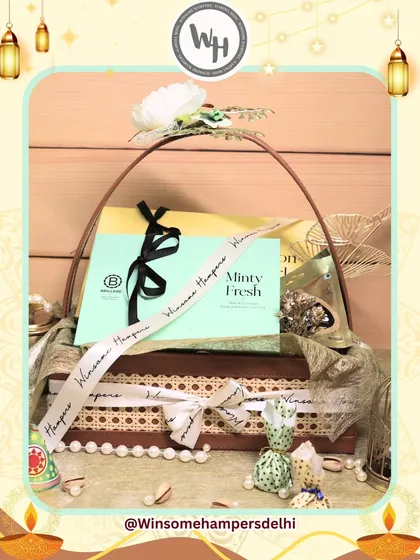 A beautifully styled shot of my Diwali hamper collaboration with Brillare. This view highlights the elegant packaging, including a pearl string detail and decorative potlis, adding a touch of traditional luxury.