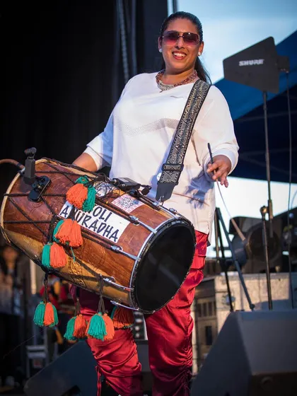 Dholi Anuradha, a powerhouse percussionist, bringing the essential beat of the dhol to the stage. Live instrumentation is a critical part of the authentic Basement Bhangra experience I produce.