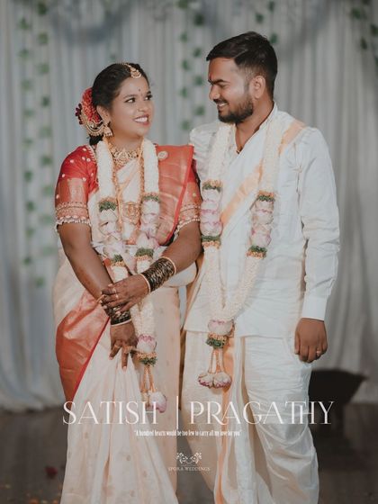 A classic portrait of the couple, with their names "Satish & Pragathy" beautifully inscribed.