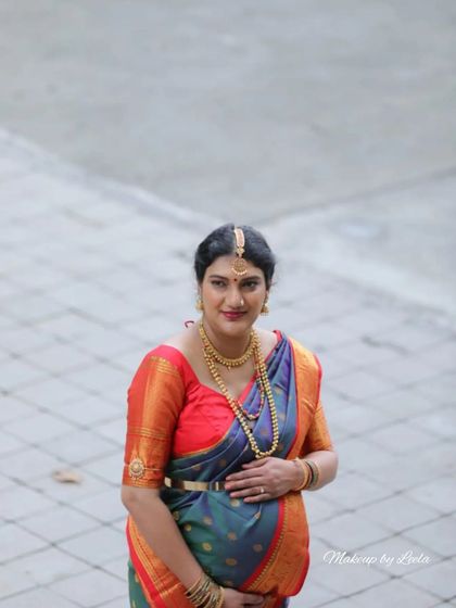 A lovely outdoor portrait of an expecting mother. Her makeup is natural and fresh, perfect for a daytime baby shower event.