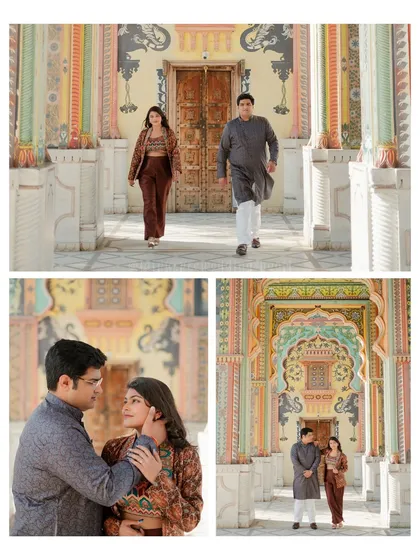 Ana and Ishan posing in front of the vibrant Patrika Gate. The intricate paintings on the arches provide a stunning and colorful background for their pre-wedding photos.