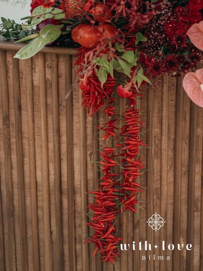 A detail of the bar decor, with a cascade of red chilies adding a spicy and playful touch to the tropical theme.