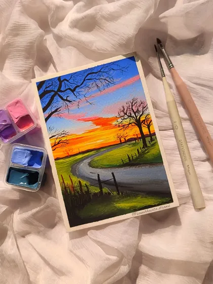 Another view of the sunset landscape, showing the gouache paints I used to create it.