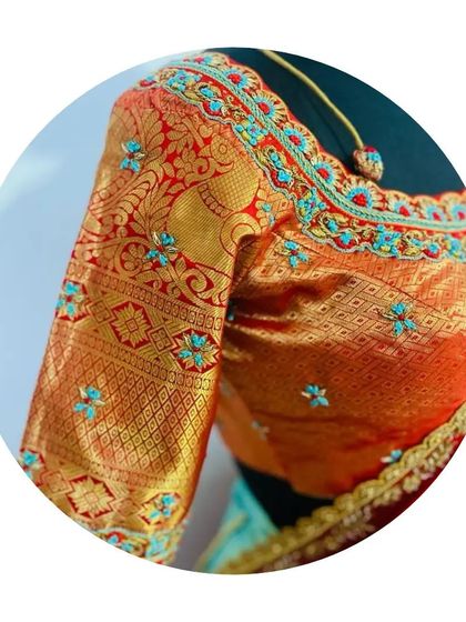 A close-up of the blouse sleeve for the half saree. The design features traditional elephant motifs on a brocade base, with delicate turquoise threadwork to tie the whole look together.