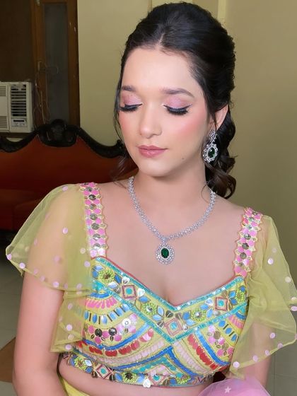 A close-up of the soft pink eye makeup with a hint of shimmer. It's a sweet and pretty look, perfect for a daytime mehndi or sangeet event.