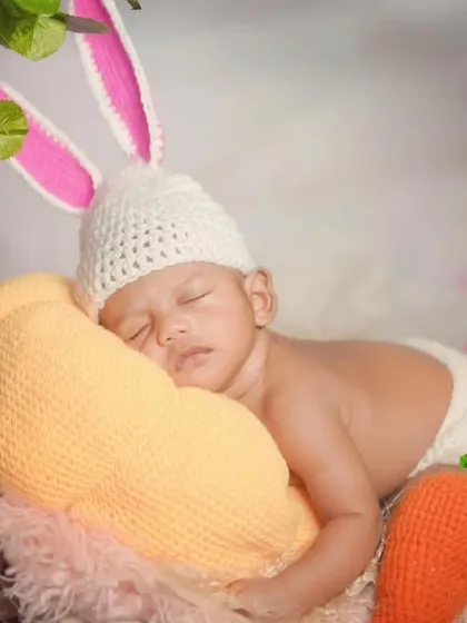 A sleepy little bunny snuggling with a giant crochet pumpkin I made. This photo shows how my outfits and props can be combined for a truly adorable and cozy newborn photoshoot.