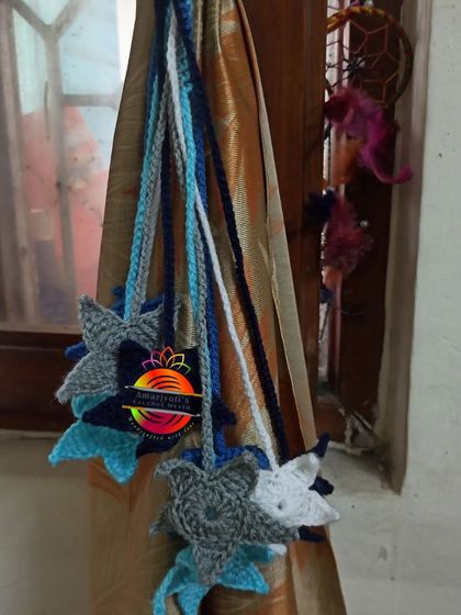For a dreamy, celestial theme, I created these star-shaped curtain tie-backs. This set uses shades of blue, grey, and white to create a lovely night-sky effect.